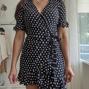 Black and white polka dot wrap dress. Rayon.